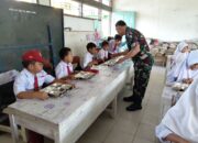Peran Aktif Babinsa Dampingi Pendistribusian Makan Bergizi Gratis