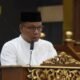 Asisten Ekonomi dan pembangunan bacakan sambutan Bupati Pinrang pada kegiatan Doa dan Zikir menyambut tahun baru 1448 H